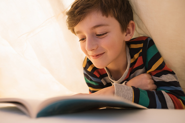 Boy reading a book.