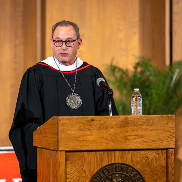 Interim Bradley President Jon Michael at podium