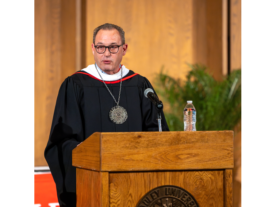 Interim Bradley President Jon Michael at podium