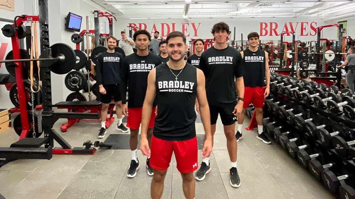Elias and his fellow Division 1 athletes pose in the gym