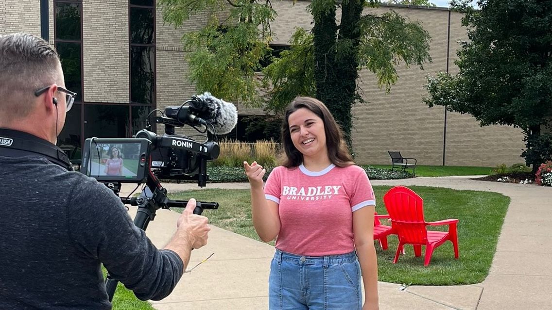 Carrigan Craig smiles for the College Tour Camera